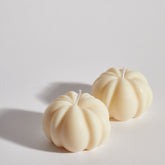 Two Boujie Small Pumpkin Decorative Candles side by side close up, handmade in soy wax with classic cream finish, styled for autumn home décor.